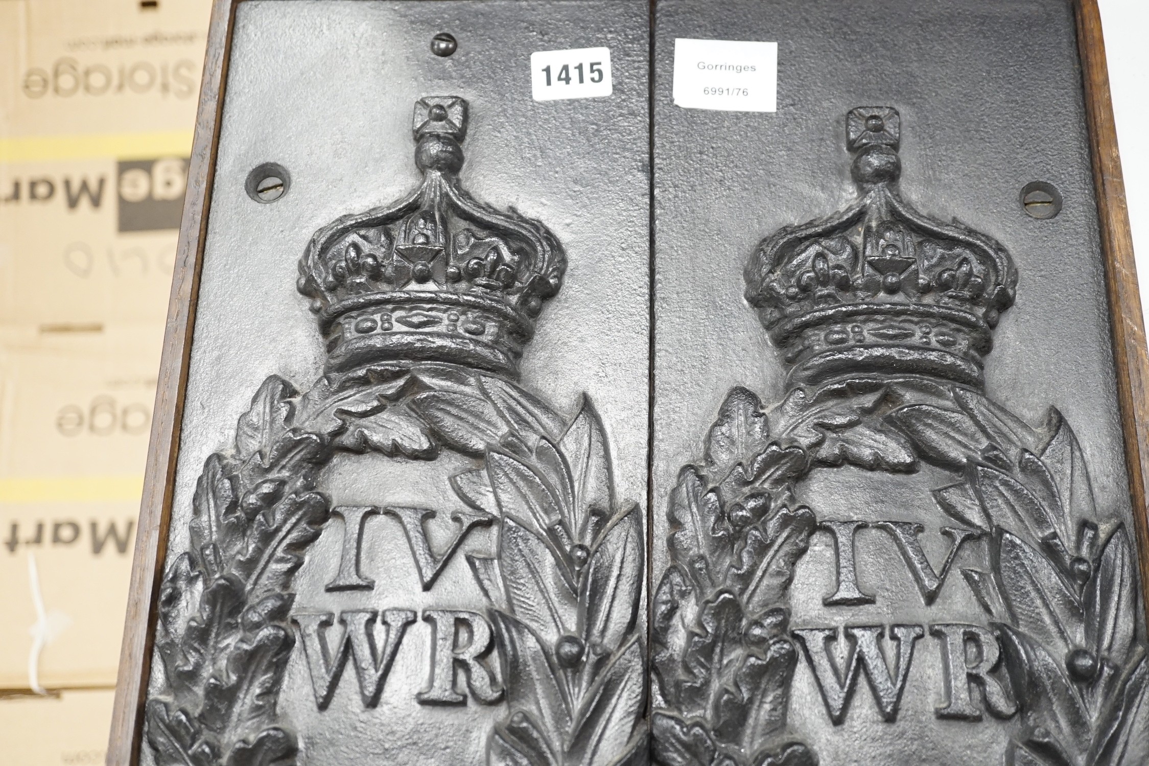 A pair of William IV Board of Ordinance cast iron framed plaques and a smaller plaque, each 54cms high x 17cms wide